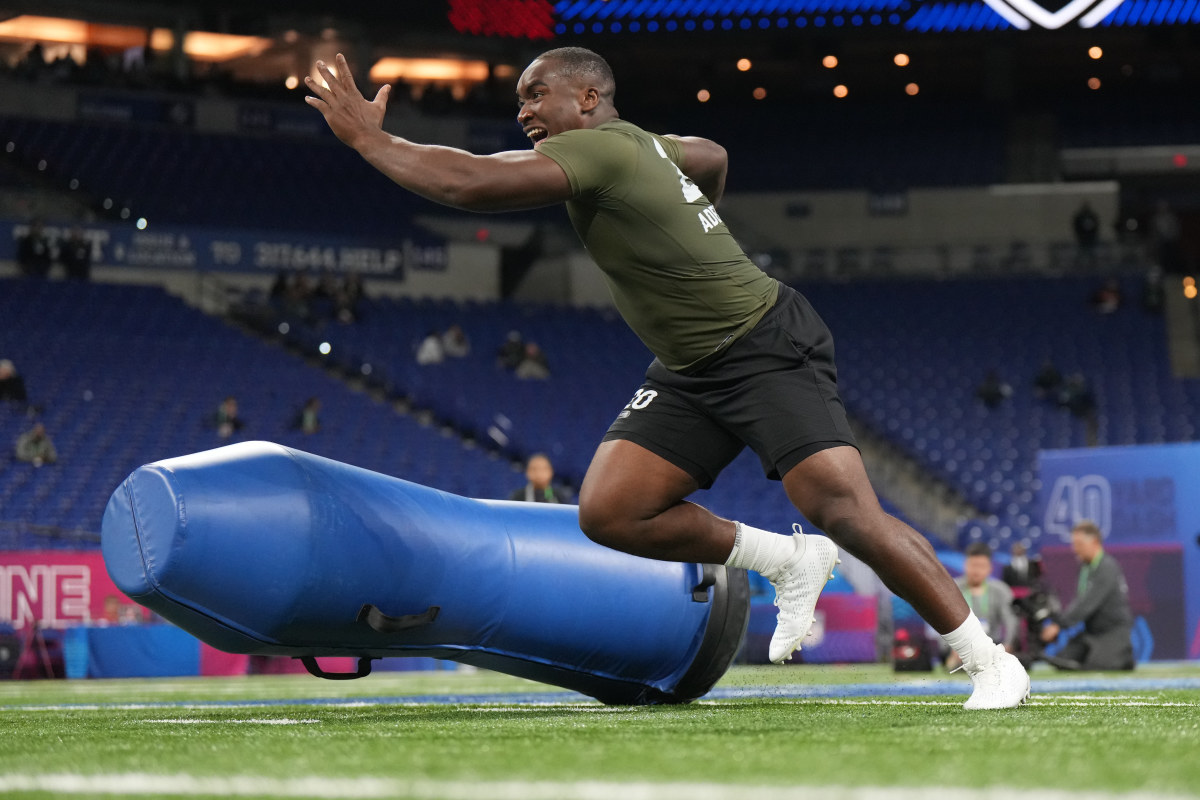 Adebawore participates in on-field drills at the NFL Scouting Combine.