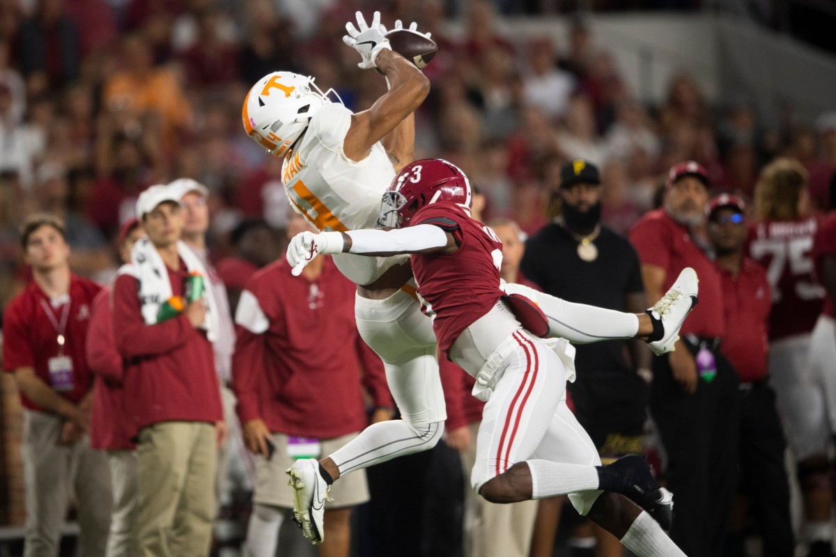 Tennessee wide receiver Cedric Tillman (4) catches a ball over Alabama defensive back Daniel Wright (3). 