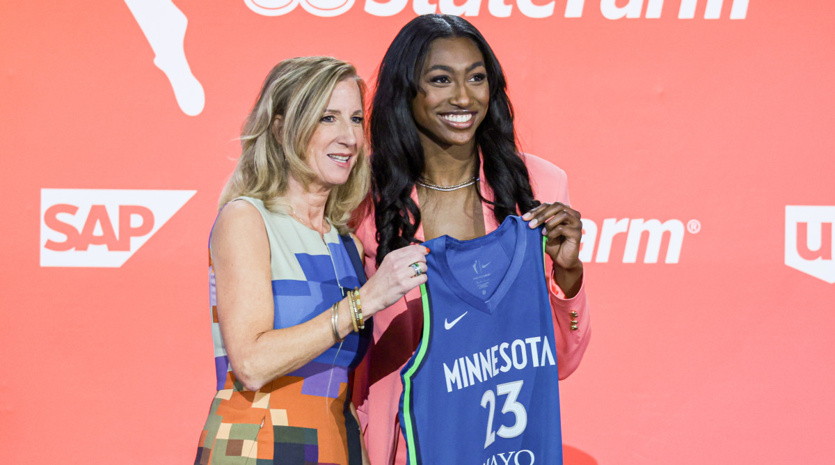 Diamond Miller poses with WNBA Commissioner Cathy Engelbert after being drafted second overall by the Minnesota Lynx during the 2023 WNBA draft.