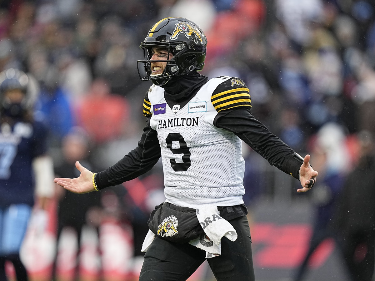 Dec 5, 2021; Toronto, Ontario, CAN; Hamilton Tiger-Cats quarterback Dane Evans (9) reacts after scoring a touchdown against the Toronto Argonauts during the Canadian Football League Eastern Conference Final game at BMO Field. Hamilton defeated Toronto. Mandatory Credit: John E. Sokolowski-USA TODAY Sports