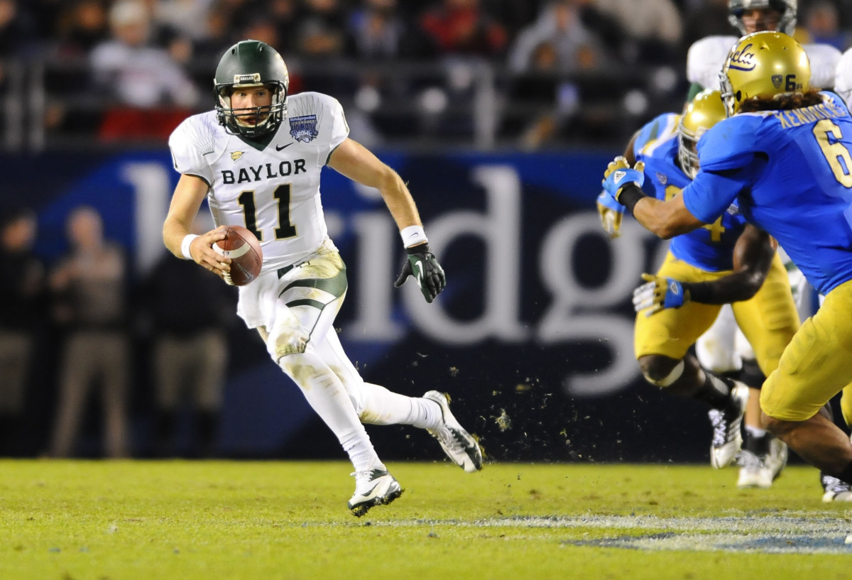 December 27, 2012; San Diego, CA, USA; Baylor Bears quarterback Nick Florence (11) scrambles for a gain during the second quarter against the UCLA Bruins in the Holiday Bowl at Qualcomm Stadium. Mandatory Credit: Christopher Hanewinckel-USA TODAY Sports