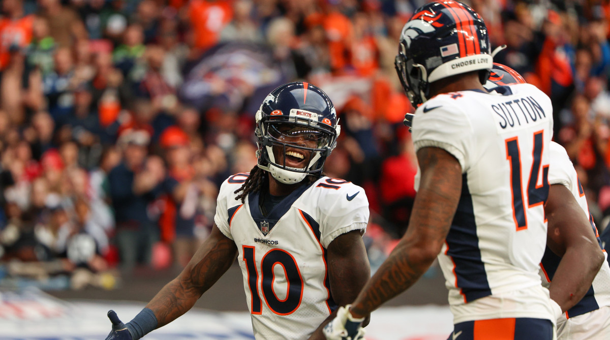 Broncos wide receiver Jerry Jeudy celebrates with Courtland Sutton.