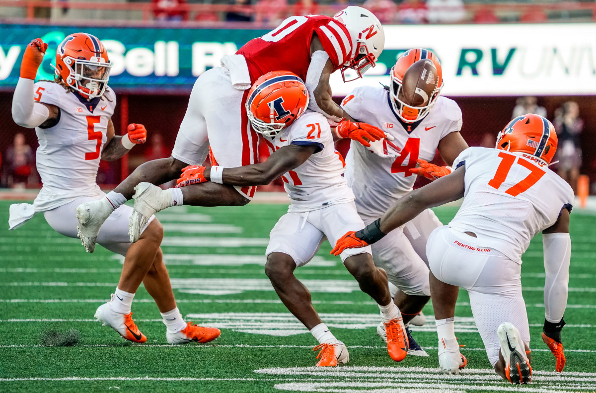 Nebraska Cornhuskers running back Anthony Grant (10) fumbles the ball against Illinois Fighting Illini defensive back Jartavius Martin (21) during the fourth quarter at Memorial Stadium