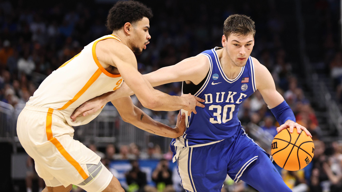 Duke Blue Devils center Kyle Filipowski drives against Tennessee Volunteers forward Olivier Nkamhoua.