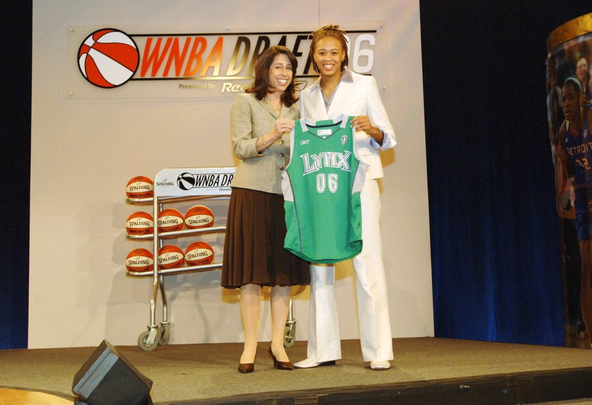 Seimone Augustus in a white suit at the 2006 WNBA draft.