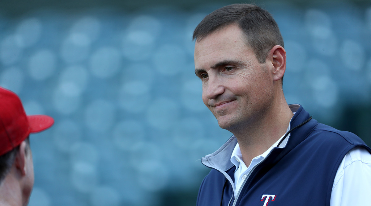 Texas Rangers general manager Chris Young talks to pitching coach Mike Maddux.