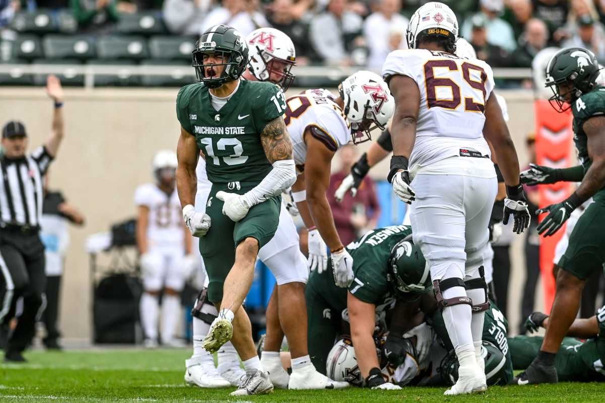 Ben VanSumeren celebrates tackle for a loss against Minnesota.