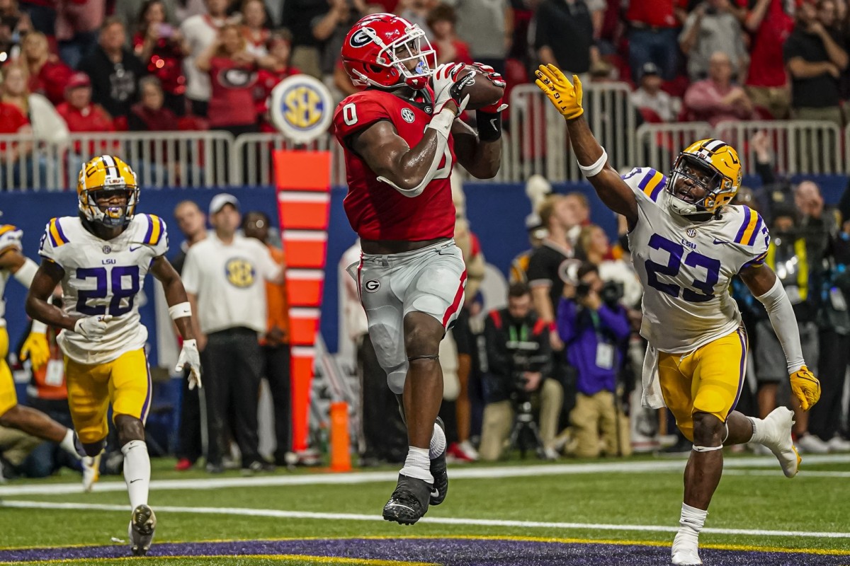 Dec 3, 2022; Georgia Bulldogs tight end Darnell Washington (0) catches a touchdown pass behind LSU Tigers linebacker Micah Baskerville (23) during the first half during the SEC Championship. Mandatory Credit: Dale Zanine-USA TODAY Sports