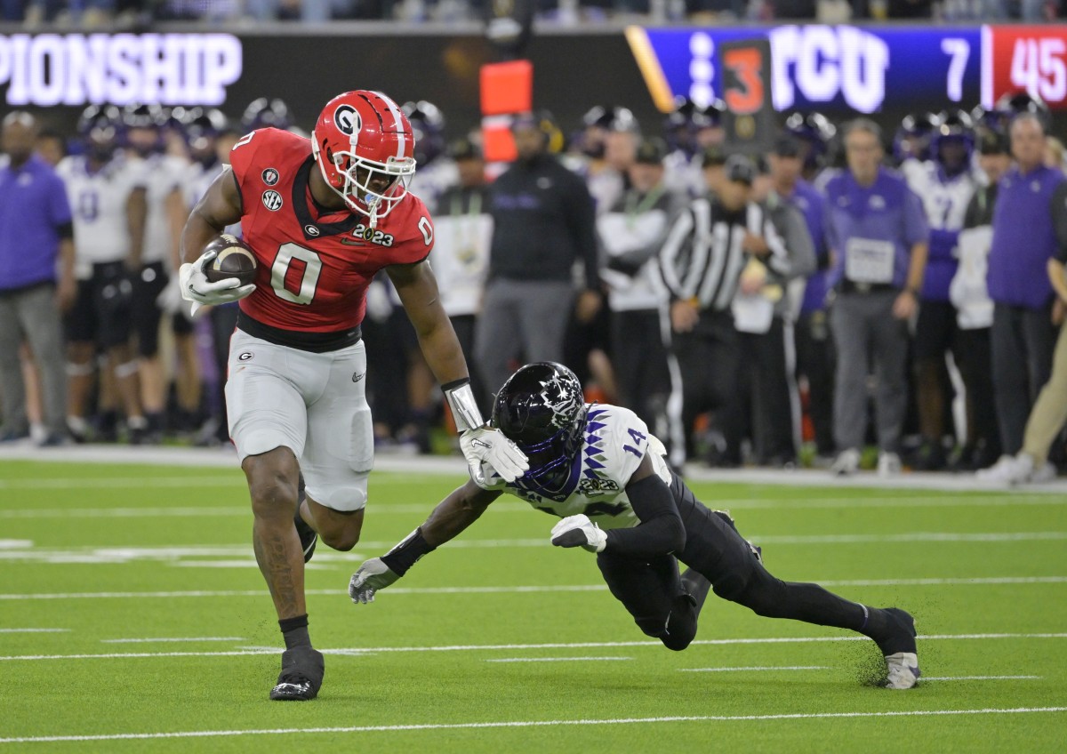 Jan 9, 2023; Georgia Bulldogs tight end Darnell Washington (0) after a catch against TCU Horned Frogs safety Abraham Camara (14) during the CFP national championship. Mandatory Credit: Jayne Kamin-Oncea-USA TODAY