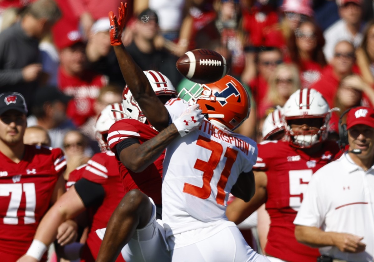 Illinois Fighting Illini defensive back Devon Witherspoon (31) breaks up the pass during the first quarter against the Wisconsin Badgers at Camp Randall Stadium.