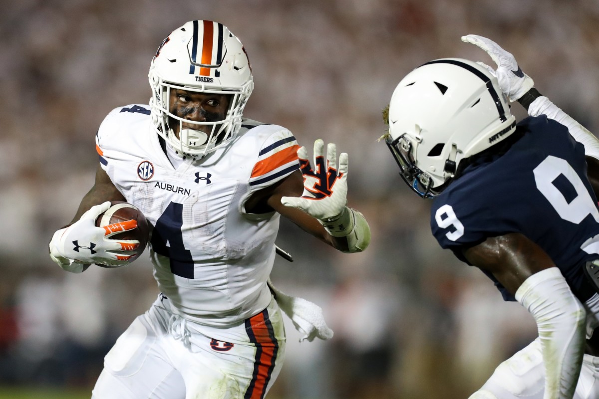 Sep 18, 2021; Auburn Tigers running back Tank Bigsby (4) runs the ball while trying to avoid a tackle from Penn State Nittany Lions cornerback Joey Porter Jr. (9). Mandatory Credit: Matthew OHaren-USA TODAY