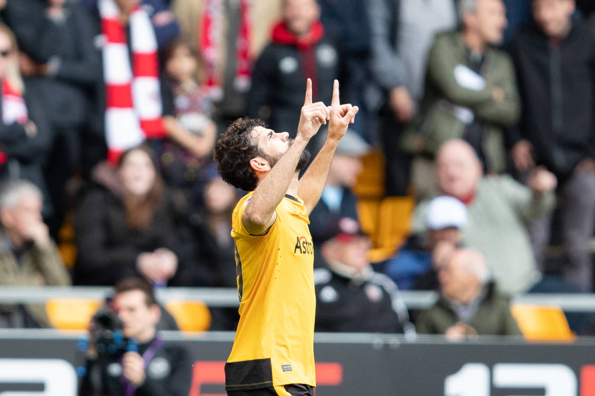 Diego Costa pictured celebrating after scoring his first goal for Wolves during a 2-0 win over Brentford in April 2023