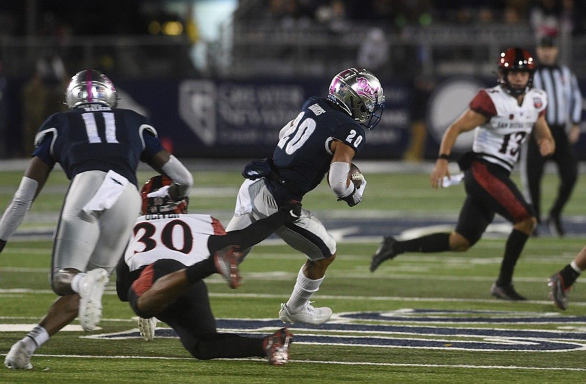 Nevada's Bentlee Sanders runs back a kick off while taking on San Diego State at Mackay Stadium in Reno on Oct. 22, 2022. Ren Unr Sdsu 2022 04