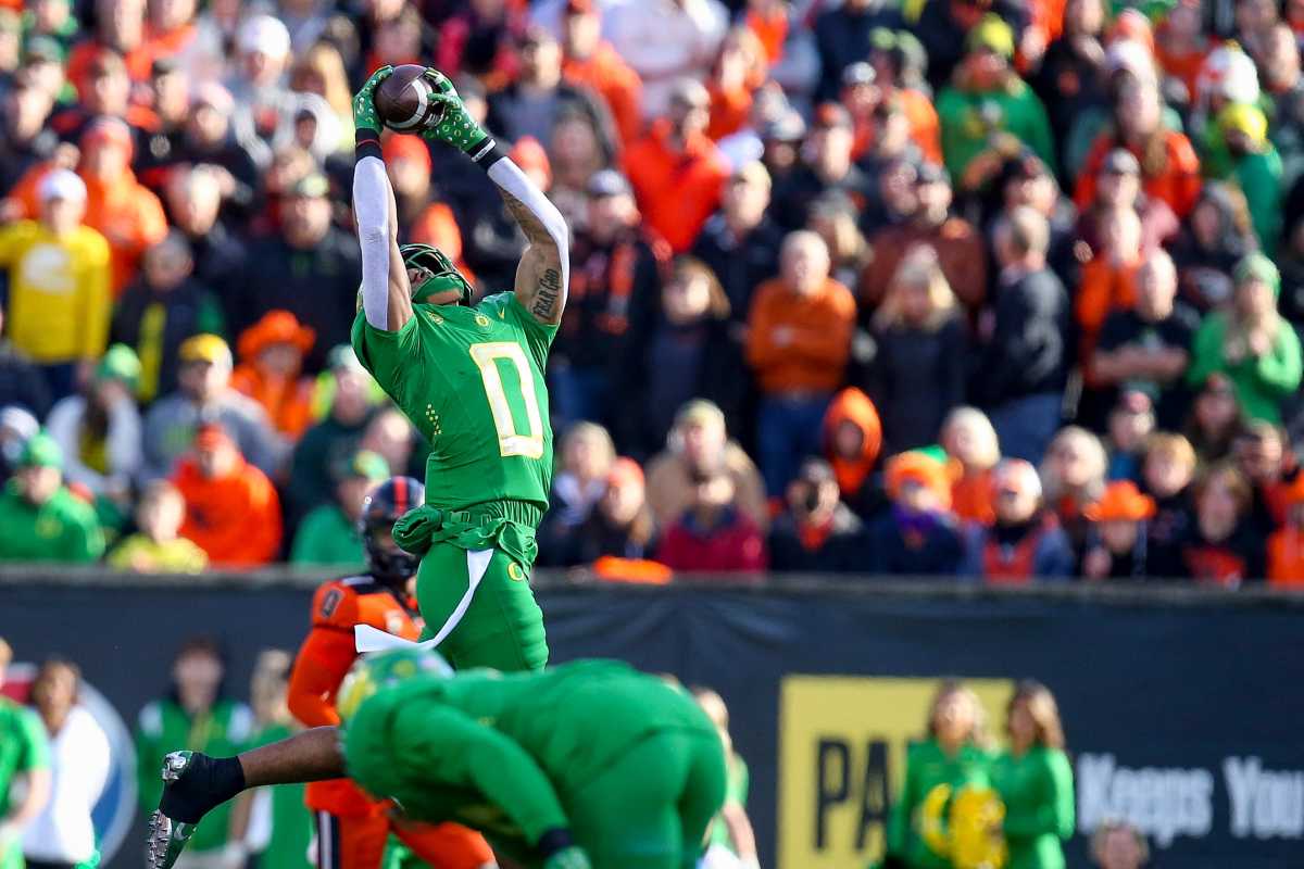 Oregon s Christian Gonzalez (0) hauls in an interception as the No. 9 Oregon Ducks take on the No. 21 Oregon State Beavers at Reser Stadium in Corvallis, Ore. on Saturday, Nov. 26, 2022. Ncaa Football Uo Vs Osu Rivalry Game University Of Oregon At Oregon State
