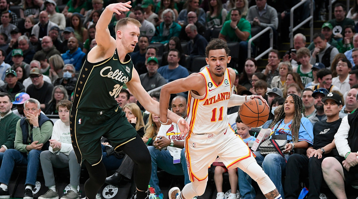 Hawks’ Trae Young dribbles past a Celtics defender in Game 1 of the NBA playoffs.