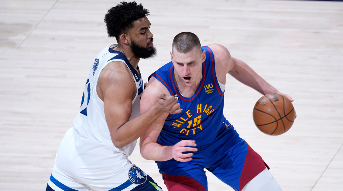 Nuggets’ Nikola Jokic posts up Timberwolves’ Karl-Anthony Towns in Game 1 of the NBA playoffs.