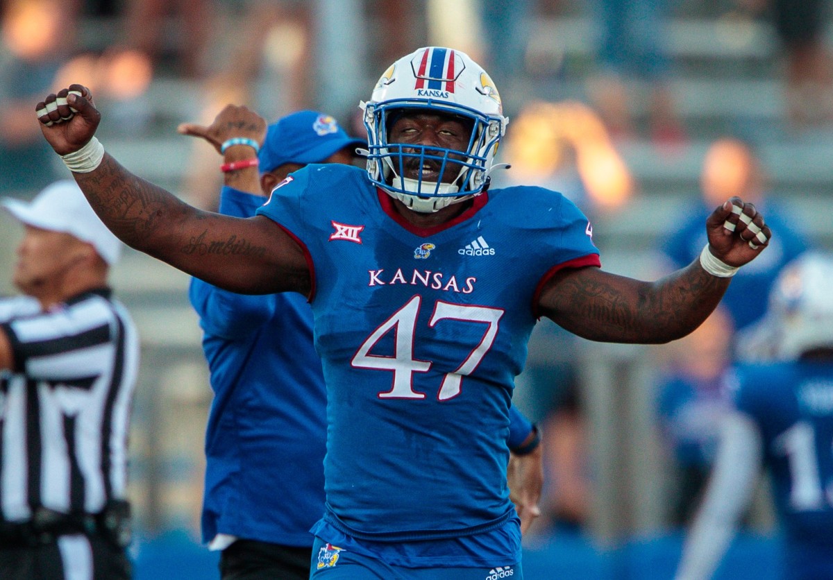 Kansas Jayhawks defensive end Lonnie Phelps (47) celebrates after the game against the Iowa State Cyclones at David Booth Kansas Memorial Stadium.
