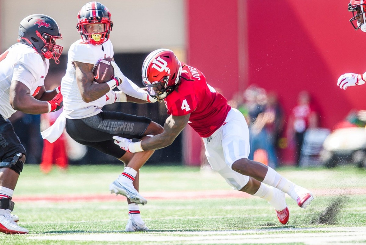 Indiana's Cam Jones (4) tackles Western Kentucky's Kye Robichaux (8) during the Indiana versus Western Kentucky football game at Memorial Stadium on Sept. 17, 2022. Iu Wk Fb 1h Jones 1
