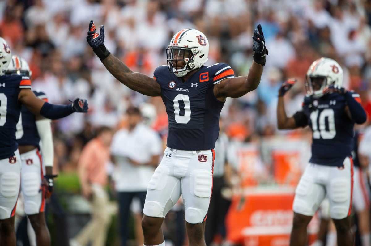 Auburn Tigers linebacker Owen Pappoe (0) pumps up the crowd as Auburn Tigers take on Mercer Bears at Jordan-Hare Stadium in Auburn, Ala., on Saturday, Sept. 3, 2022. Auburn Tigers leads Mercer Bears 28-7 at halftime.