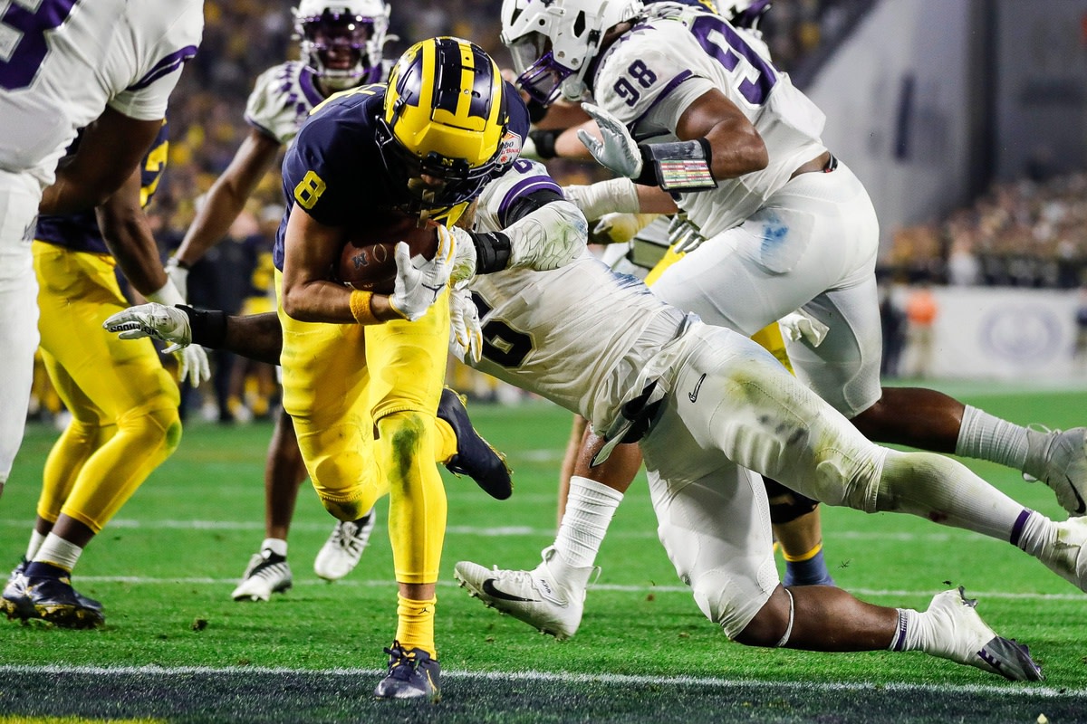 Michigan wide receiver Ronnie Bell (8) scores a two point conversion against TCU during the second half at the Fiesta Bowl at State Farm Stadium in Glendale, Ariz. on Saturday, Dec. 31, 2022.