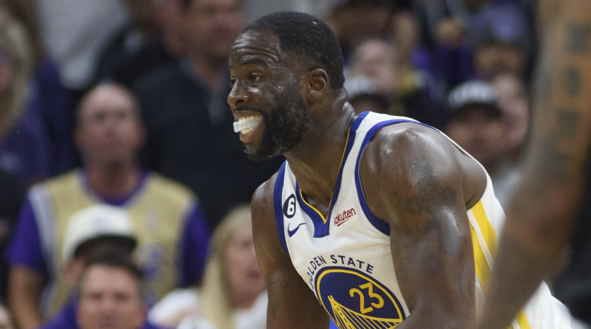 Draymond Green reacts incredulously after being called for a foul for stomping on Damontas Sabonis