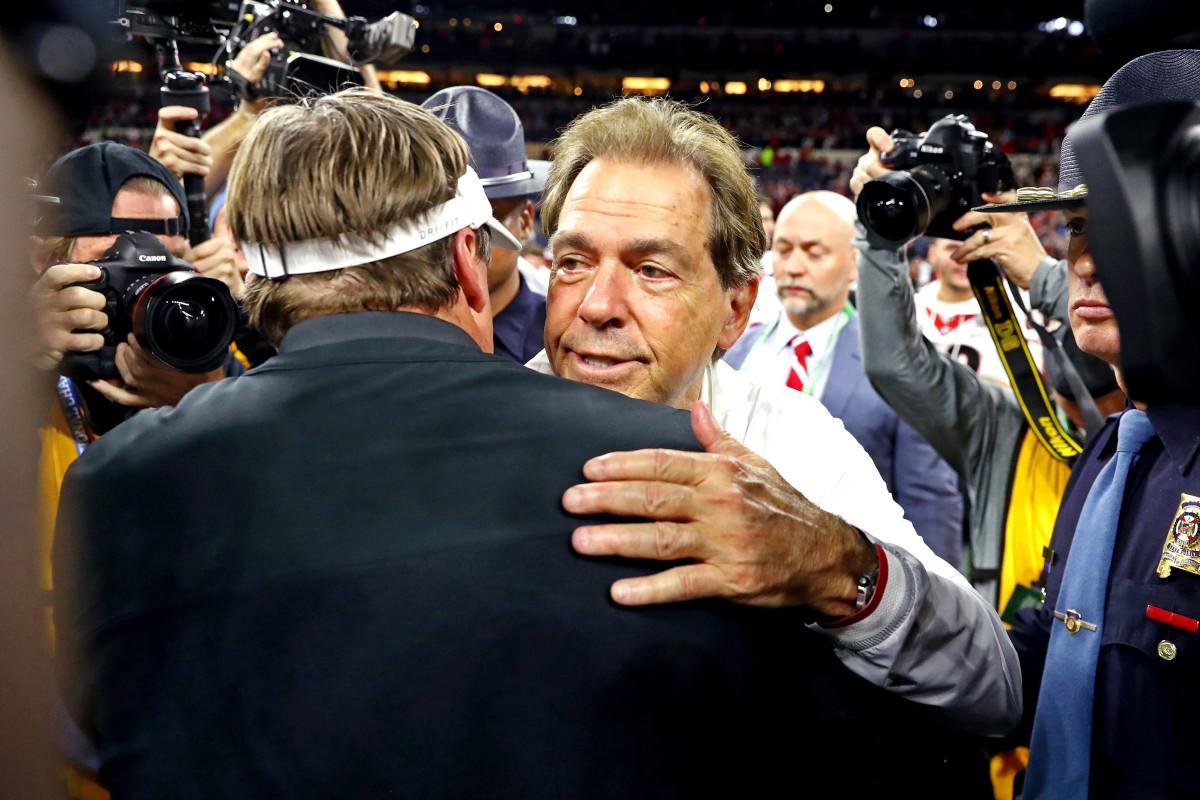 Jan 10, 2022; Indianapolis, IN, USA; Alabama Crimson Tide head coach Nick Saban and Georgia Bulldogs head coach Kirby Smart shake hands after the 2022 CFP college football national championship game at Lucas Oil Stadium.