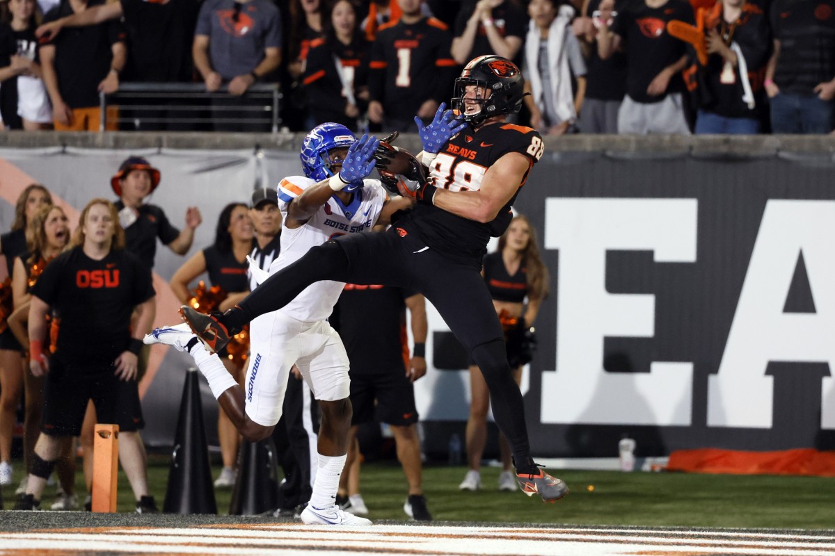 Sep 3, 2022; Corvallis, Oregon, USA; Oregon State Beavers tight end Luke Musgrave (88) makes a catch in the end zone for a touchdown while being defended by Boise State Broncos corner back Tyreque Jones (21) during the first half at Reser Stadium. Mandatory Credit: Soobum Im-USA TODAY Sports