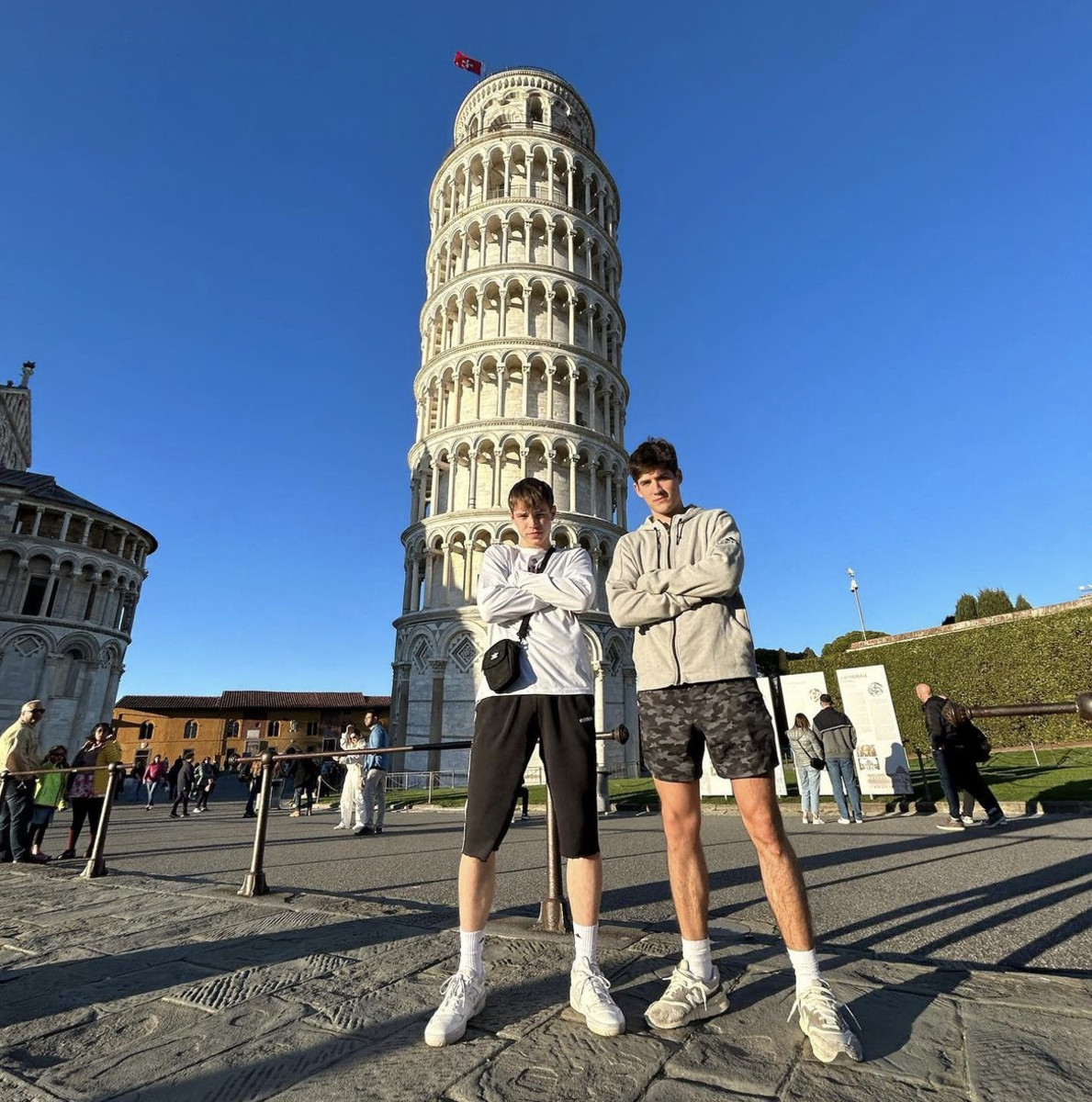 Gabe Cupps (left) and Reed Sheppard (right) stand in front of the Leaning Tower of Pisa during their trip to Italy with Team Ohio for the Junior International Tournament in Lissone, Italy.