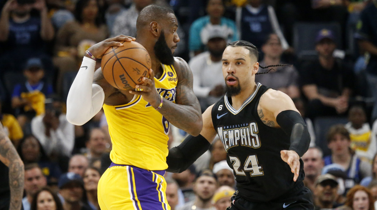 Grizzlies forward Dillon Brooks defends Lakers forward LeBron James.