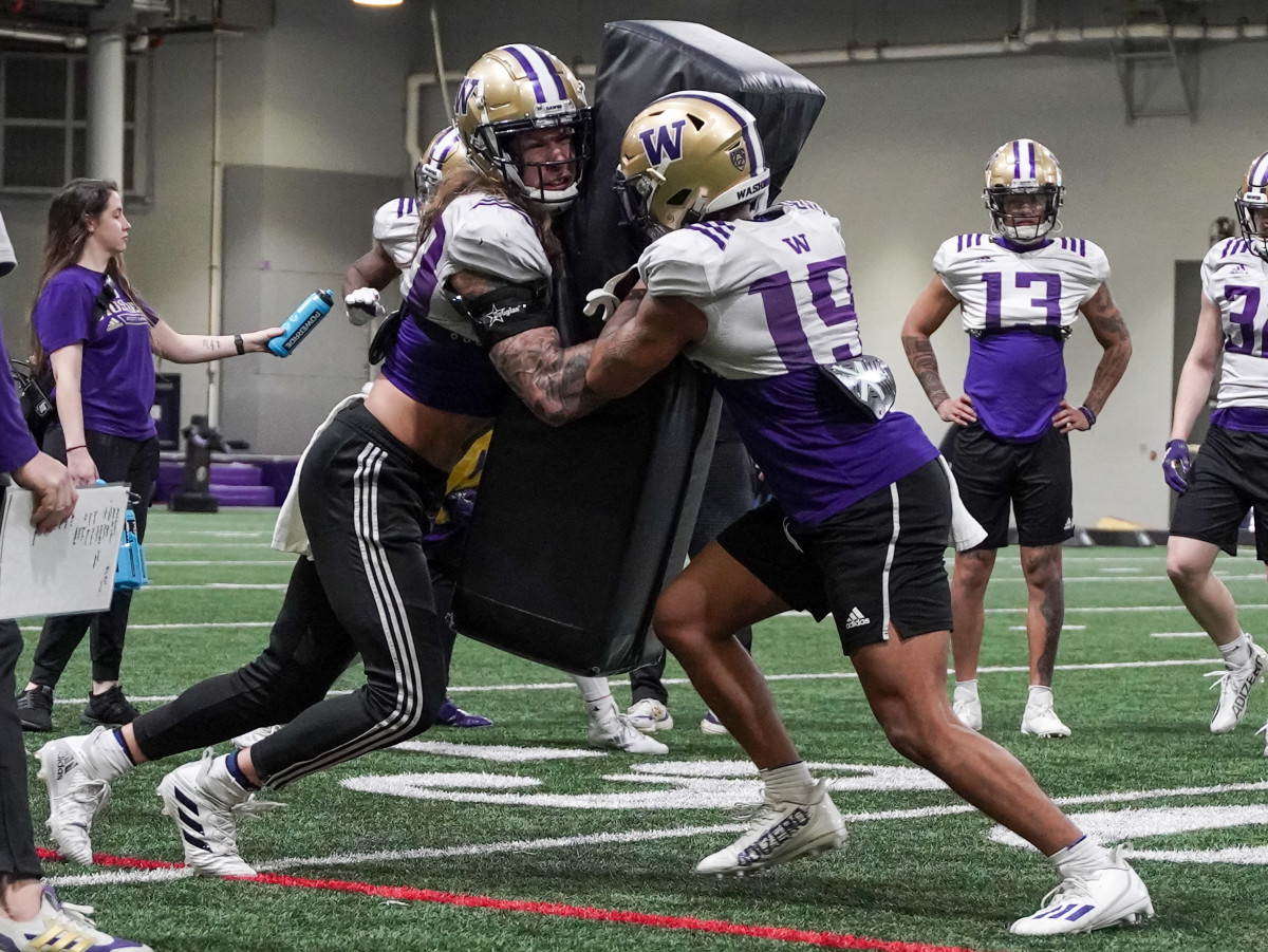 Asa Turner and Dyson McCutcheon mix it up at spring practice.