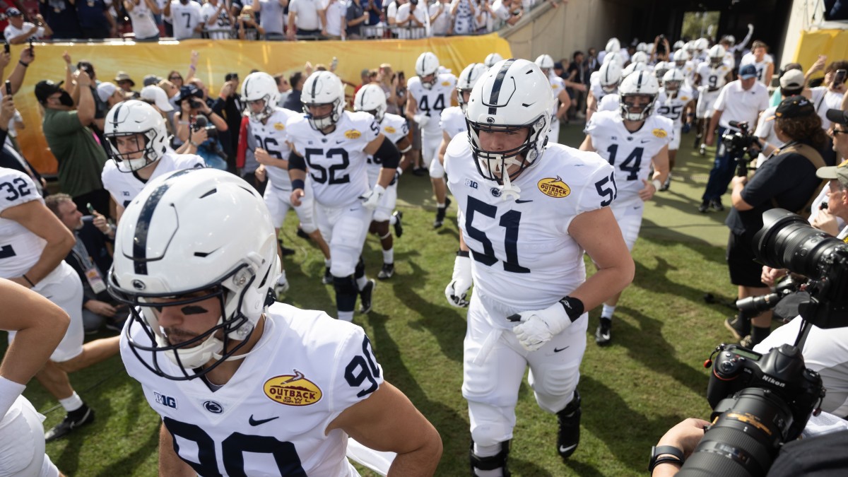 Penn State Nittany Lions offensive lineman Jimmy Christ (51) runs onto the field before the game against the Arkansas Razorbacks during the 2022 Outback Bowl at Raymond James Stadium.