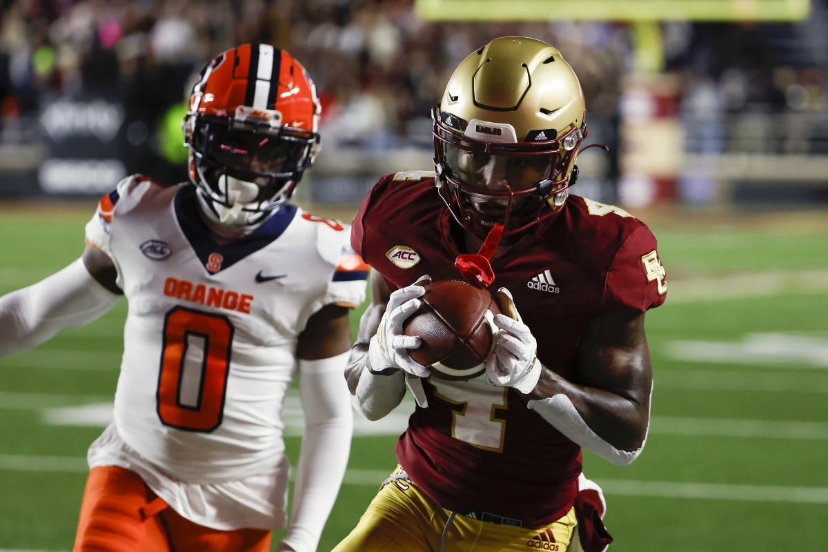 Boston College Eagles wide receiver Zay Flowers (4) catches a pass behind Syracuse Orange defensive back Darian Chestnut (0) during the second quarter at Alumni Stadium.