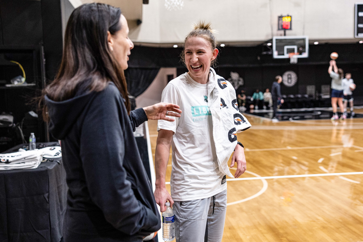 Courtney Vandersloot of the New York Liberty laughs while at a team workout.