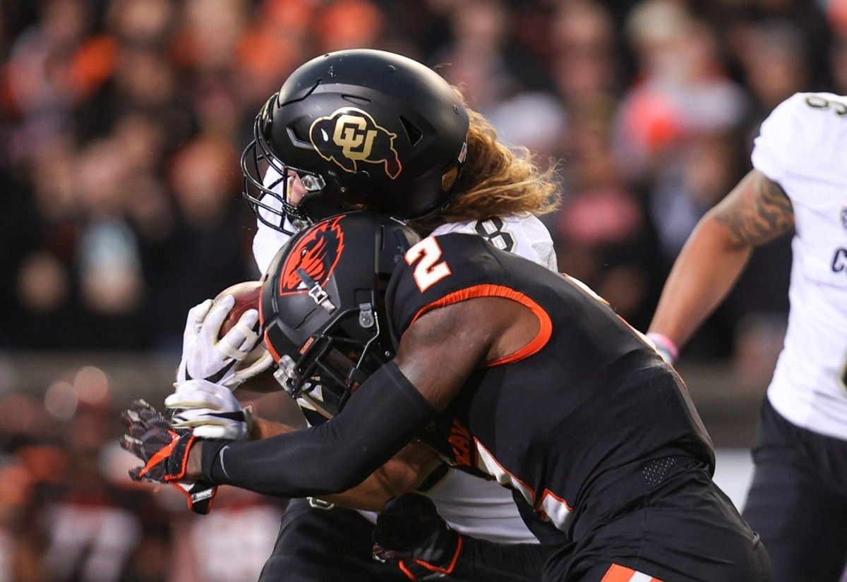 Colorado tight end Brady Russell (38) collides with Oregon State defensive back Rejzohn Wright (2) during the second quarter at Reser Stadium in Corvallis, Ore. on Saturday, Oct. 22, 2022. Syndication Statesman Journal Syndication Statesman Journal