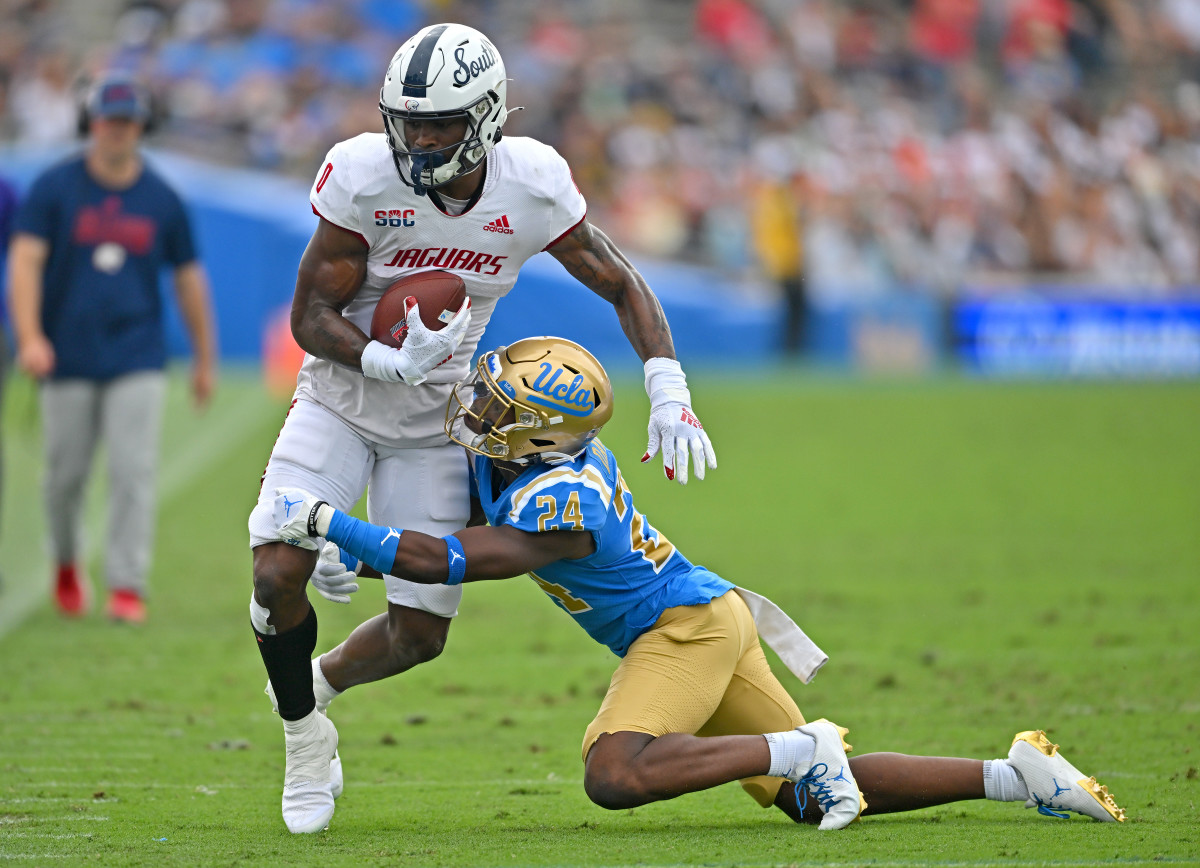 Sep 17, 2022; Pasadena, California, USA; South Alabama Jaguars wide receiver Jalen Wayne (0) runs for a first down before he is forced out of bounds by UCLA Bruins defensive back Jaylin Davies (24) in the first half at the Rose Bowl.
