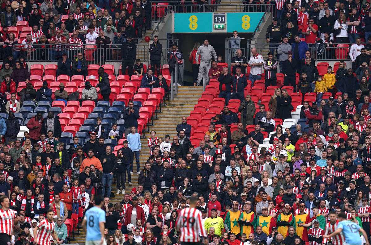 A photo taken during the FA Cup semi-final between Sheffield United and Manchester City in April 2023 shows some of more than 20,000 seats that were left empty at Wembley Stadium