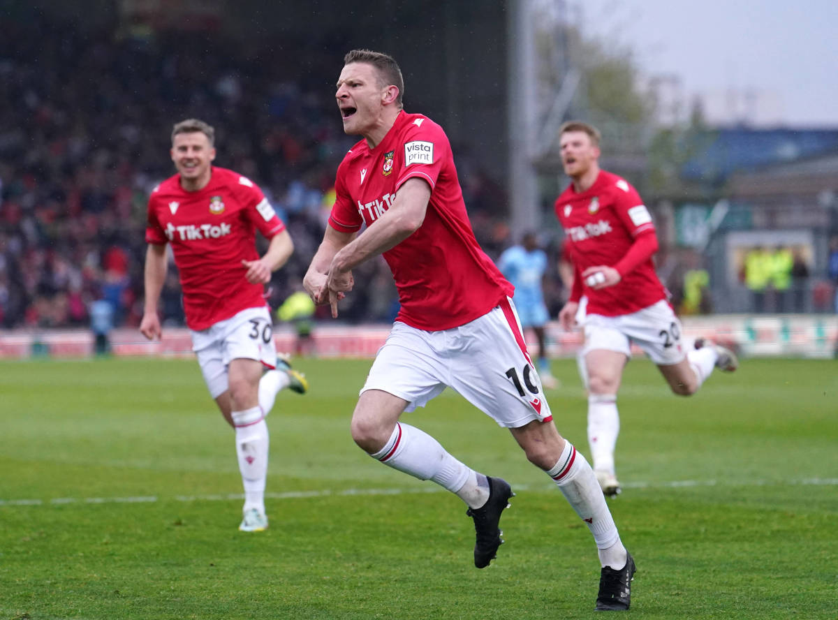 Wrexham AFC striker Paul Mullin pictured (center) celebrating after scoring his 47th goal of the 2022/23 season