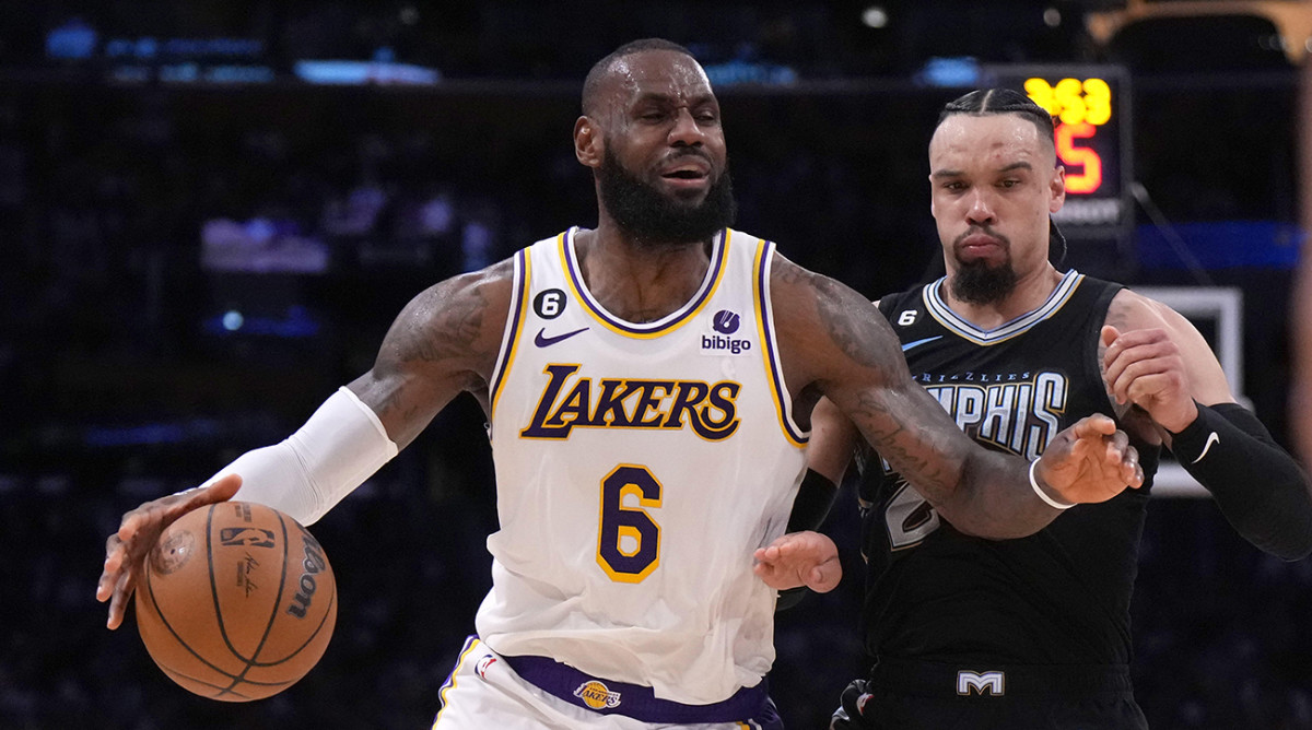 Los Angeles Lakers forward LeBron James (6) dribbles the ball against Memphis Grizzlies forward Dillon Brooks (24).