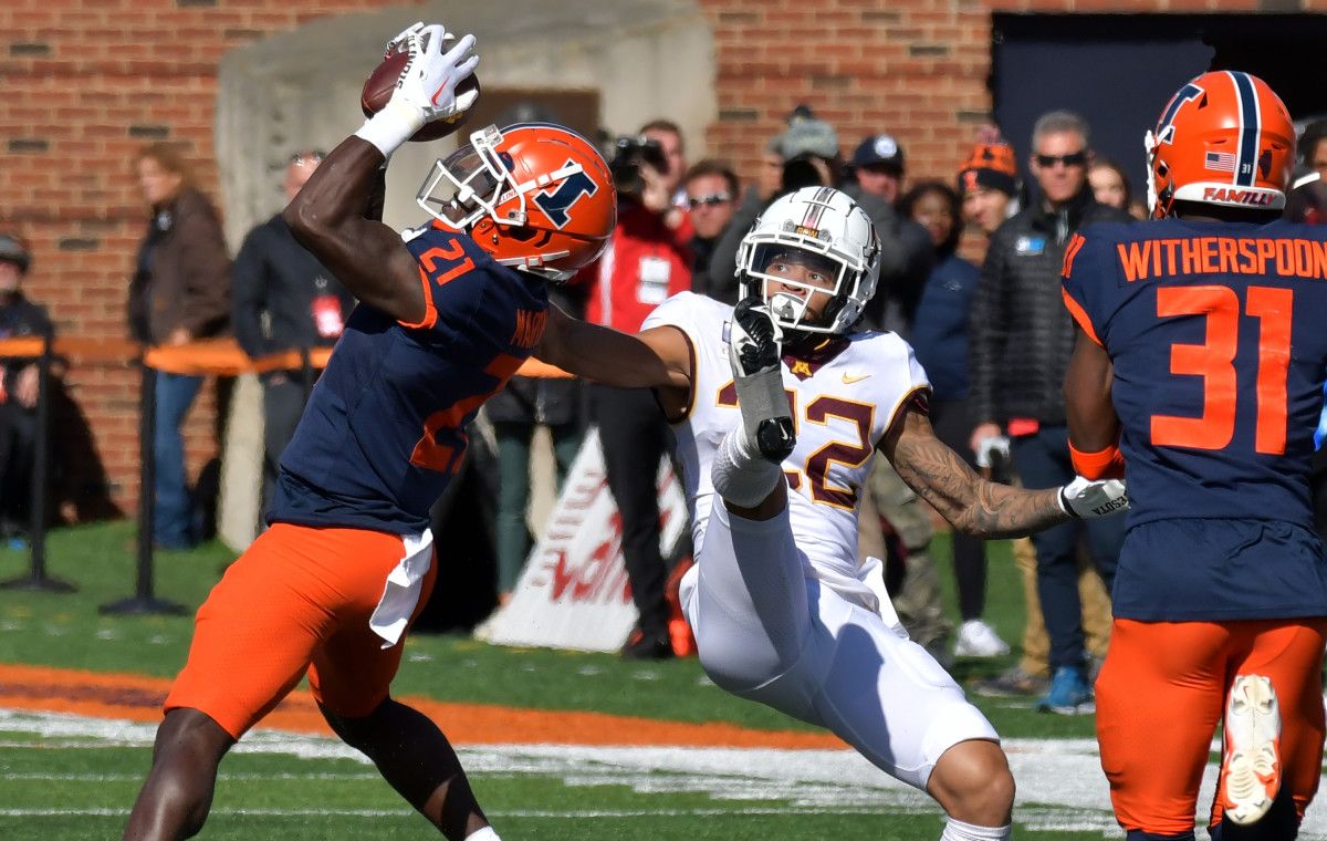 Jartavius Martin (21) intercepts the ball intended for Minnesota Golden Gophers wide receiver Michael Brown-Stephens (22)