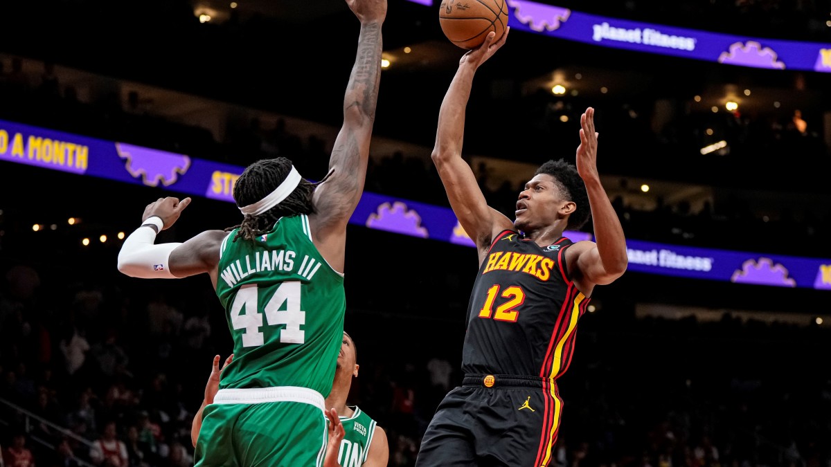Atlanta Hawks forward De'Andre Hunter (12) shoots over Boston Celtics center Robert Williams III (44) during the second half during game four of the 2023 NBA playoffs at State Farm Arena.