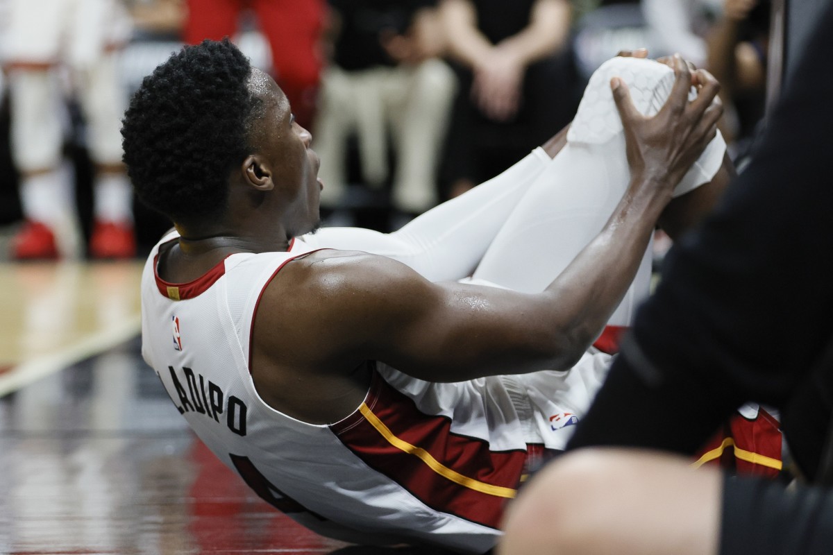 Miami Heat guard Victor Oladipo (4) reacts after getting injured in the fourth quarter