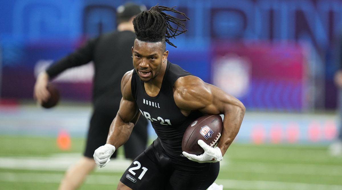 Texas running back Bijan Robinson runs a drill at the NFL football scouting combine in Indianapolis.