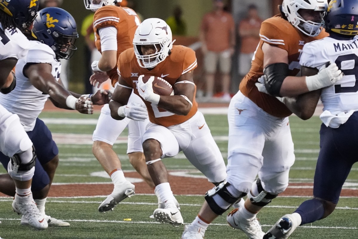 Oct 1, 2022; Austin, Texas, USA; Texas Longhorns running back Roschon Johnson (2) runs for yards during the first half against the West Virginia Mountaineers at Darrell K Royal-Texas Memorial Stadium. Mandatory Credit: Scott Wachter-USA TODAY Sports