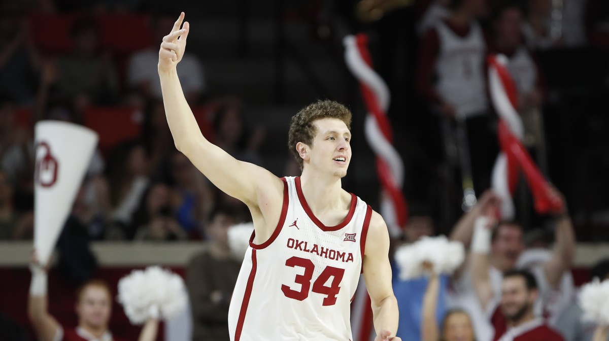 Oklahoma Sooners forward Jacob Groves (34) gestures after scoring a three point basket against the TCU Horned Frogs during the first half at Lloyd Noble Center.