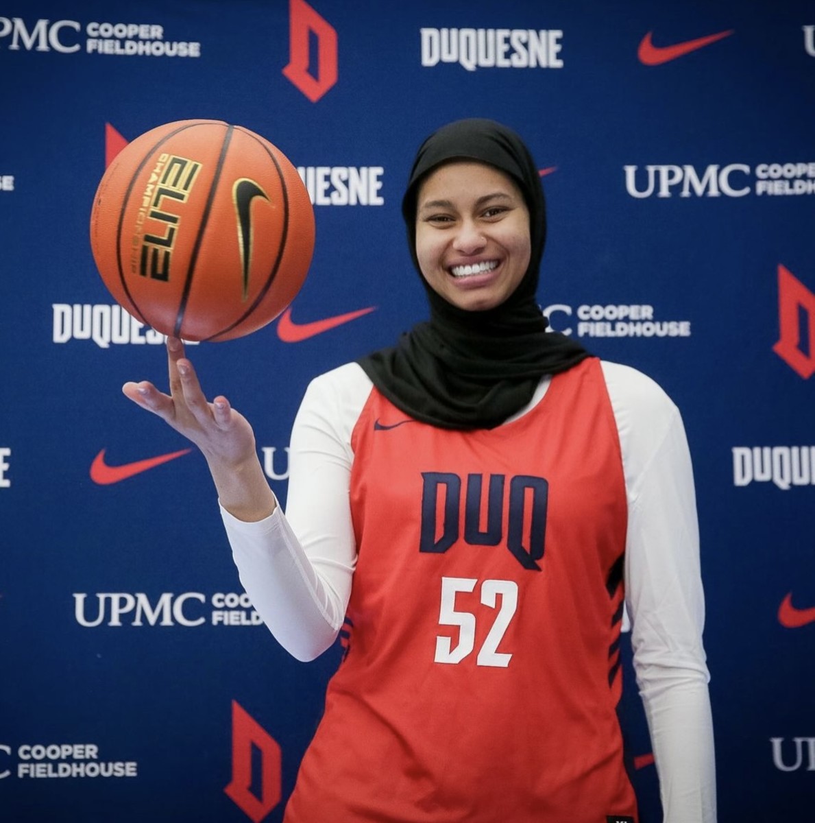 Kiandra Browne poses in her new No. 52 Duquesne University jersey.