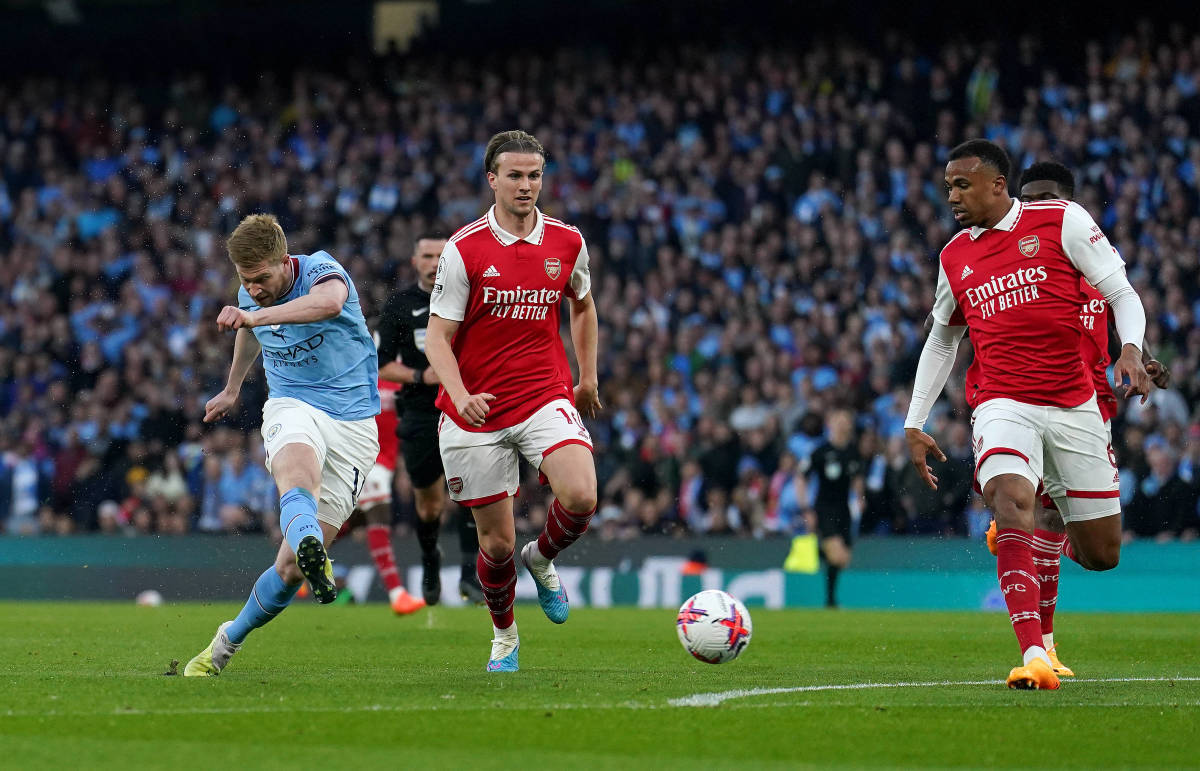 Kevin De Bruyne pictured (left) scoring for Manchester City against Arsenal in the Premier League in April 2023