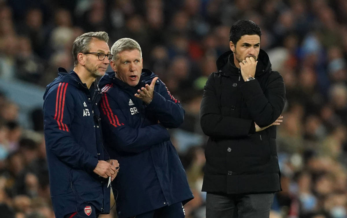 Arsenal manager Mikel Arteta pictured (right) with assistants Albert Stuivenberg (left) and Steve Round on the touchline during the team's 4-1 defeat at Manchester City in April 2023