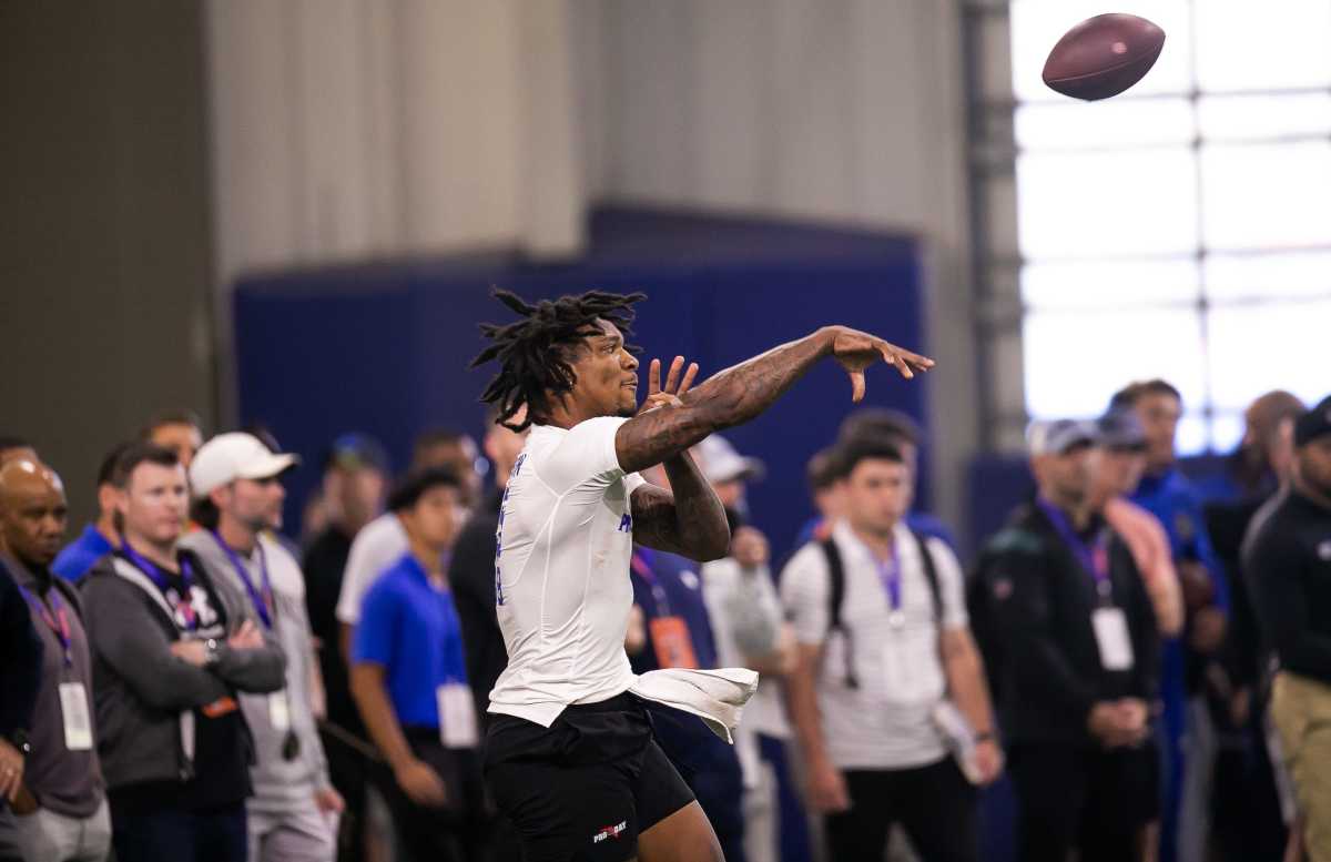 NFL Scouts watch as Florida Gators quarterback Anthony Richardson (15) passes during the 2023 NFL Pro Day held at Condron Family Indoor Practice Facility in Gainesville, FL on Thursday, March 30, 2023. Richardson will meet with six NFL teams. They are the Panthers, Colts, Titans, Raiders, Falcons and Ravens.