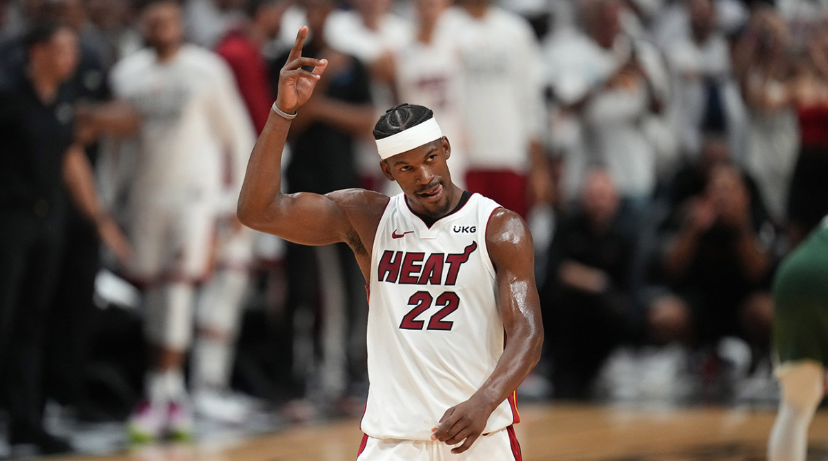 Miami Heat forward Jimmy Butler waves to the crowd after making a shot against the Milwaukee Bucks.