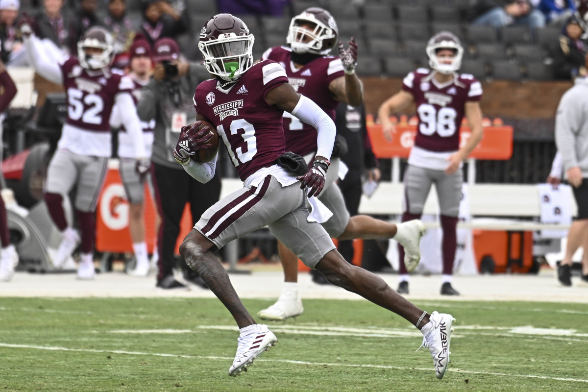 Nov 19, 2022; Starkville, Mississippi, USA; Mississippi State Bulldogs cornerback Emmanuel Forbes (13) returns an interception for a touchdown against the East Tennessee State Buccaneers during the second quarter at Davis Wade Stadium at Scott Field.